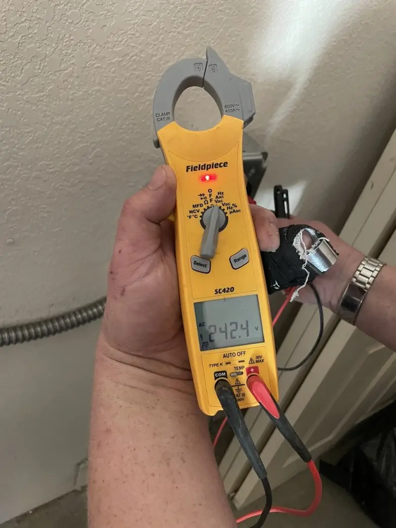 Voltage testing with clamp meter during Circuit Breaker Repair in Candor